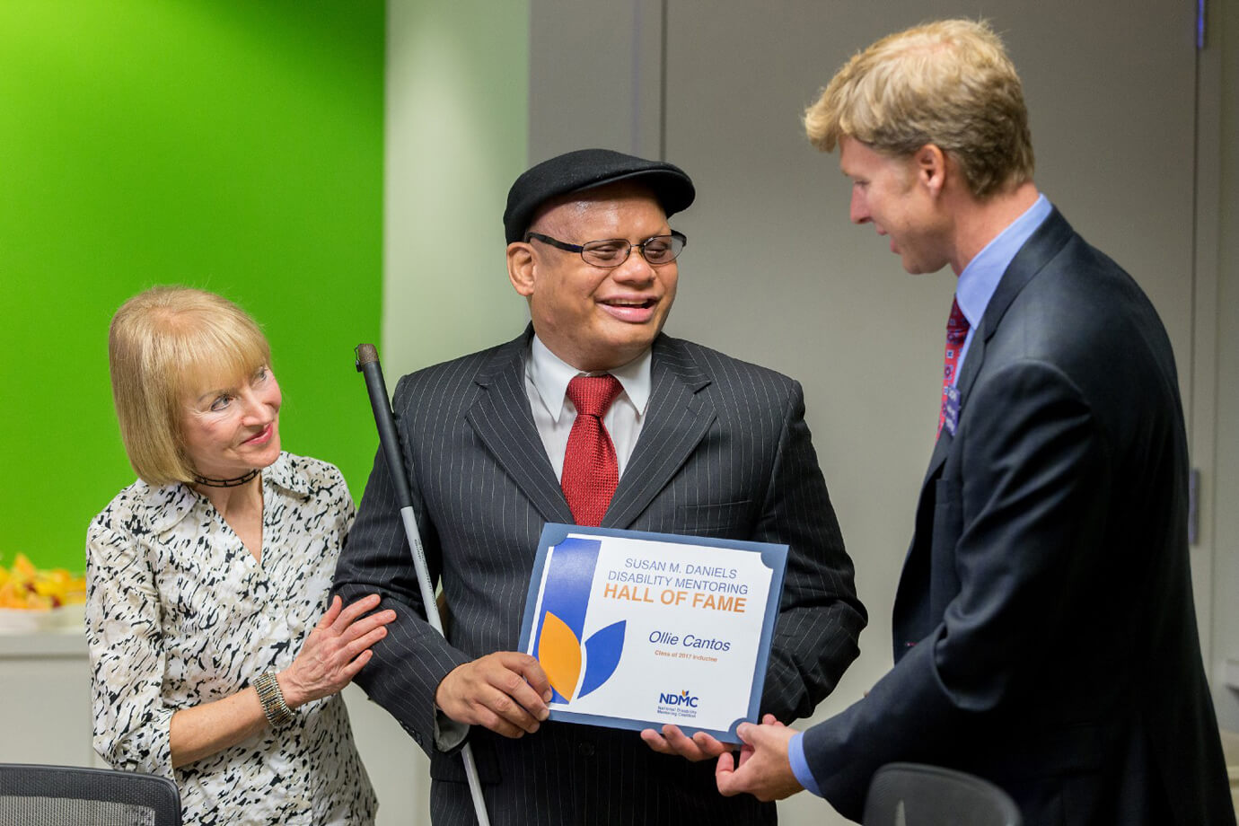 Ollie Cantos accepts his induction into the Disability Mentoring Hall of Fame